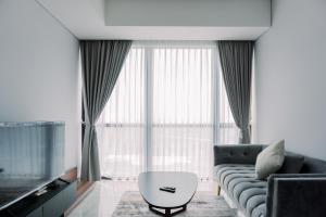 Wonderful and Homey 1BR The Smith Alam Sutera Apartment By Travelio