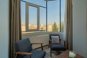 Top-Floor Romanian Athenae 2BR Apartment, Quiet City Views