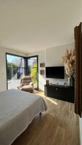 Maisons de vacances L-Oasis de Coulaines - Elegance & piscine : photos des chambres