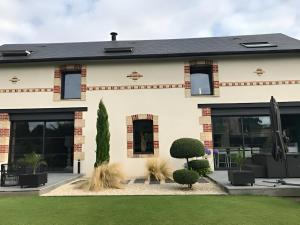Maisons de vacances L-Oasis de Coulaines - Elegance & piscine : photos des chambres