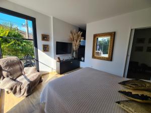 Maisons de vacances L-Oasis de Coulaines - Elegance & piscine : photos des chambres