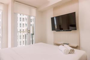 Simply Look and Comfy Studio at Tokyo Riverside PIK 2 Apartment By Travelio