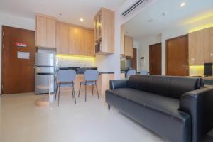 Minimalist and Homey 1BR at Ciputra World 2 Apartment By Travelio