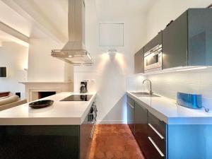 Appartements Le 100% Uzes, charme en plein centre historique : photos des chambres