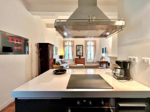 Appartements Le 100% Uzes, charme en plein centre historique : photos des chambres