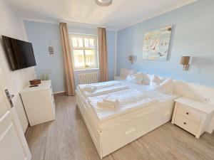 Dünenpark Binz - Komfortplus Ferienwohnung mit 1 Schlafzimmer und Balkon im Obergeschoss 302