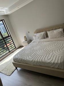 smart elegant three bedroom apartment with swimming pool fully equipped gym child play area proximity to shopping malls and great breathtaking views