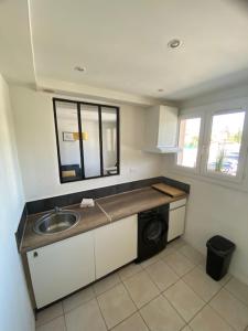 Appartements Le Myosotis Route des plages : photos des chambres