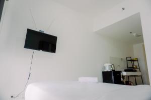 Simply and Cozy Stay Studio Apartment M-Town Residence By Travelio