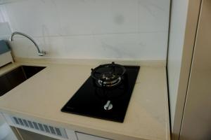 Minimalist and Nice Studio at Sky House Alam Sutera Apartment By Travelio