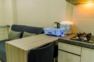 Comfort and Simply 2BR at Green Pramuka City Apartment By Travelio