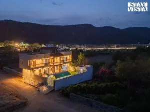 StayVista at The Binclave with Bar, Pool - Amer