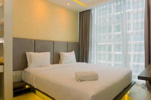 Fancy and Nice 1BR at Brooklyn Alam Sutera Apartment By Travelio
