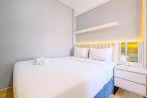 Homey and Modern Look 2BR Transpark Cibubur Apartment By Travelio - Kalimanggis 1