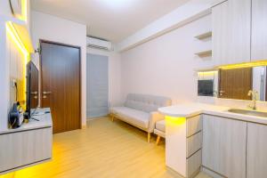 Homey and Modern Look 2BR Transpark Cibubur Apartment By Travelio