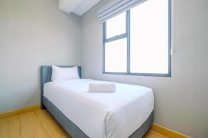 Homey and Modern Look 2BR Transpark Cibubur Apartment By Travelio