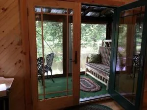 Riverfront Cabin Rental with Lovely Screened Porch near Potsdam, New York - Long Sault