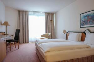 Superior Queen Room with Sofa Bed room in Holiday Inn Essen City Centre an IHG Hotel
