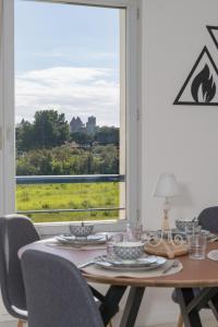 Appartements Lumaia - Vue cite, terrasse & Piscine : photos des chambres