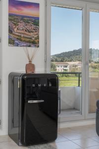 Appartements Lumaia - Vue cite, terrasse & Piscine : photos des chambres