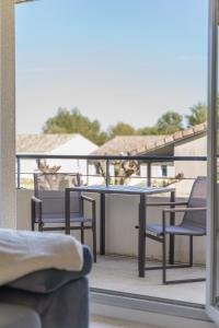 Appartements Lumaia - Vue cite, terrasse & Piscine : photos des chambres