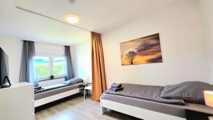 Moderne Monteurwohnung mit Balkon, Einzelbetten, voll ausgestattet, kostenloser Parkplatz & WLAN in Hagen - HL01