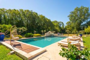 Lodges Le Mas des lys - Guest houses au coeur de la Provence dans un parc paysage avec piscine, sauna et boulodrome : photos des chambres
