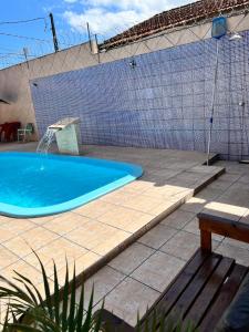 Casa com piscina pertinho da praia