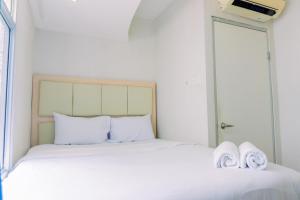 Cozy Stay and Tidy 1BR Green Bay Pluit Apartment By Travelio