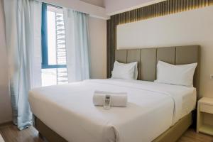 Homey and Spacious 3BR at Sky House BSD Apartment By Travelio