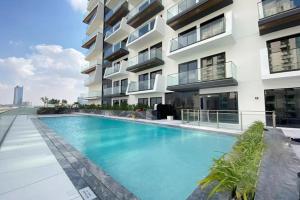 Chic 1BR in JVC with Balcony, Near Mall & Parks