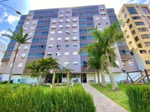 Belo apto com lindo jardim em Capão da Canoa