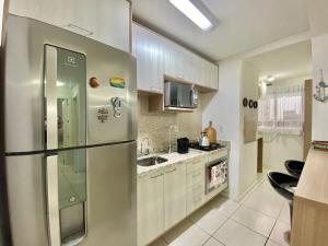 Belo apto com lindo jardim em Capão da Canoa