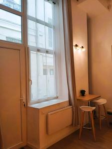 Appartements studio en mezzanine, metro et rue centrale mais calme : photos des chambres