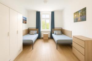 Monteurszimmer Move-in2Stay - Einzelbetten, Smart TV, Wifi
