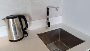 luxury Andromeda apartment with spacious bedroom and views of the sea and sunny landscapes