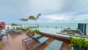 Flat pé na areia com estacionamento