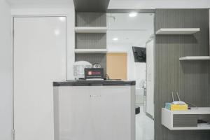 Comfort Studio at Menteng Square Apartment By Travelio