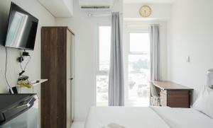 Cozy Studio at Amazana Serpong Apartment By Travelio