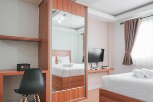 Best Homey Elegant Studio Room at Amethyst Apartment By Travelio