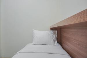 Cozy Living 2BR Green Pramuka City Apartment next to Mall By Travelio