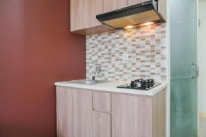 Cozy Living 2BR Green Pramuka City Apartment next to Mall By Travelio