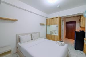 Modern and Homey Studio at Gunung Putri Apartment By Travelio