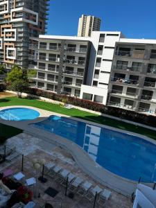 Bright holiday apartment withPool