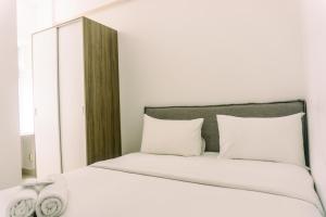 Minimalist 2BR Apartment at Serpong Garden near Train Station By Travelio