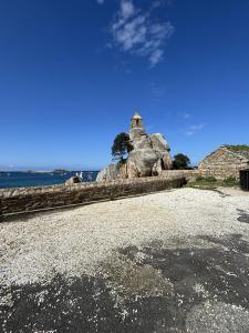 Maisons de vacances hjem Port Blanc A breathtaking setting facing th : photos des chambres