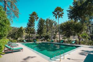 Bel-La Monde Riverside Jim Corbett - "A Unit of Luxe Opera Hotels & Resorts"