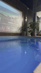 Casa com telão e Área gourmet 550 metros da praia