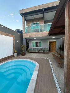 Casa com telão e Área gourmet 550 metros da praia