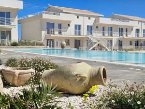 Bilocale in resort con piscine